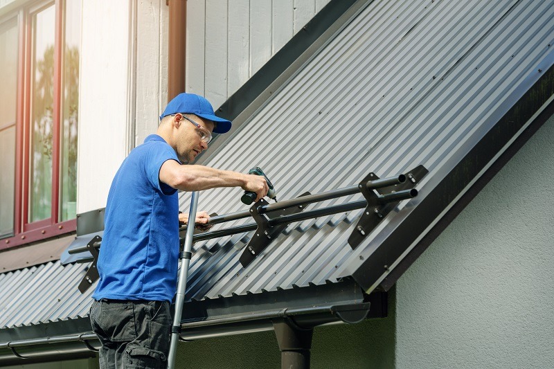 Roofing company Metal Roof Install Snow Guards